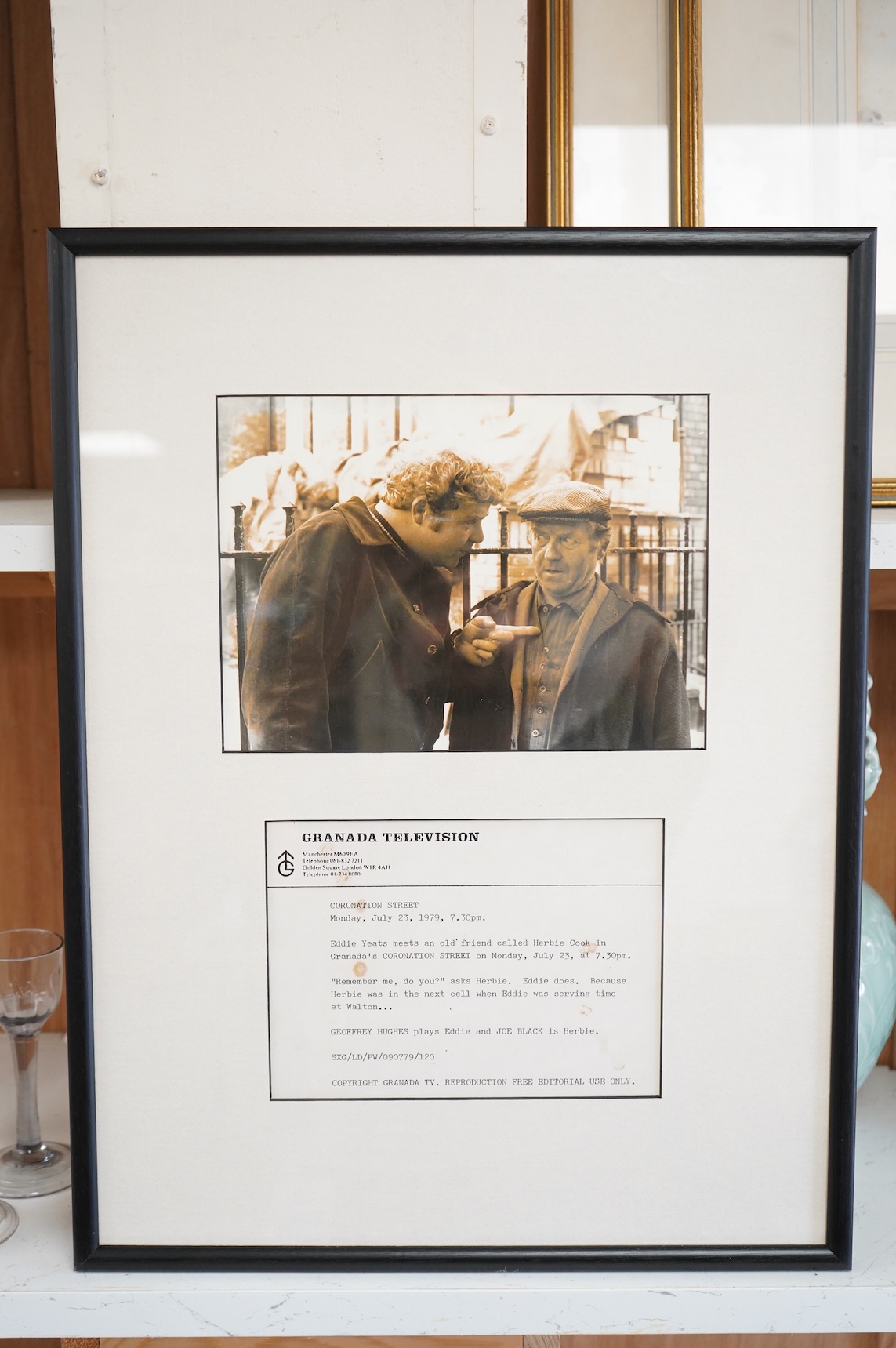 A Granada TV, Coronation Street promotional photograph, Geoffrey Hughes and Joe Black, framed, 51cm high